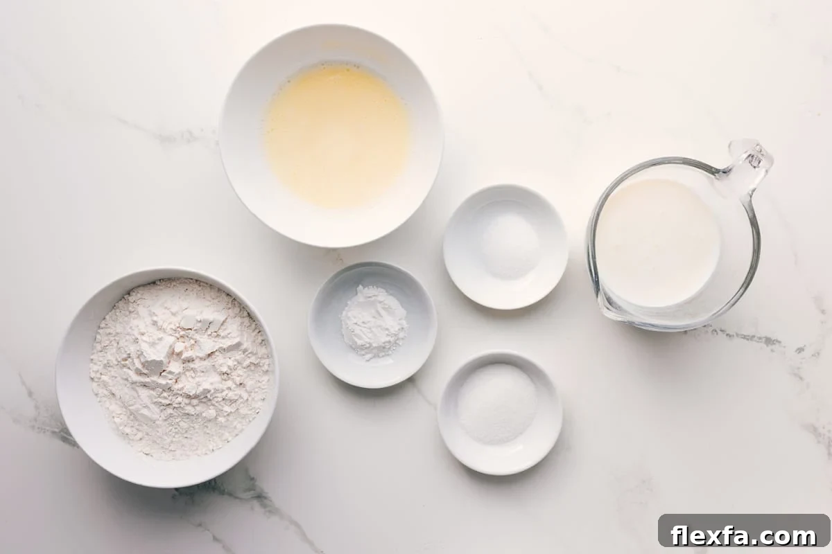How to Make Fluffy Southern Drop Biscuits 4 All the ingredients in this recipe prepped out for easy assembly including the flour, butter, baking powder, salt, sugar, and buttermilk.